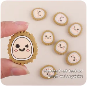 Close-up of small cartoon durian silicone teether bead for baby pacifier clips