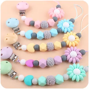 Silicone and wooden baby pacifier clips with daisy beads in five pastel colors