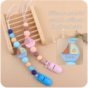 Detailed view of silicone sailboat pacifier clips with food-grade round beads