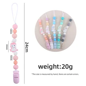 Silicone unicorn pacifier clips in macaron colors with detailed size measurements