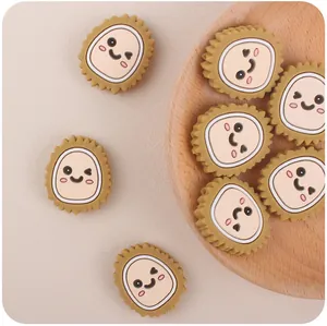 Detailed view of yellow cartoon durian silicone beads with cute smiley faces for DIY baby teethers