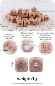 Macro detail of 12mm beech wood square beads with engraved patterns for DIY pacifier chains