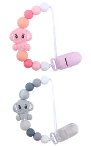 Detail view of silicone baby pacifier clips with cute cartoon elephant beads and safe clips