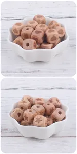 Macro detail of 12mm beech wood square beads with heart and star engraving for DIY crafts