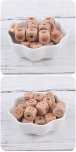 Detail of 12mm square beech wood beads with engraved heart and smile face for DIY pacifier clips