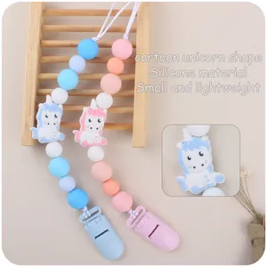 Silicone baby pacifier clip with unicorn beads for teething and soothing in pink and blue