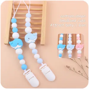 Blue silicone pacifier clip with cartoon whale beads for baby teething relief
