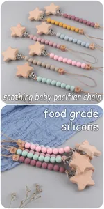 Detail of food grade silicone beads and beech wood star clip on baby pacifier chain