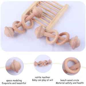 Hochet pour bébé en bois de hêtre design spatial et anneau de dentition moteur