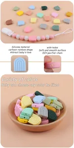 Détail de perles en silicone arc-en-ciel avec trous pour attaches-tétines DIY