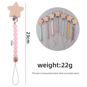 Silicone and beech wood baby pacifier clip chain with star pattern 23cm length