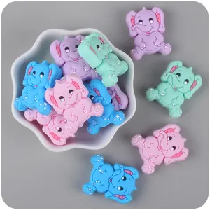 Macro detail of colorful cartoon elephant silicone beads for DIY pacifier clip accessories