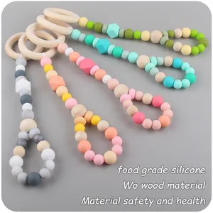 Detail of wooden beech rings and food-grade silicone beads in various shapes and colors