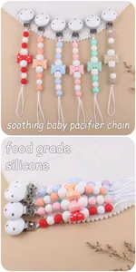 Detail of colorful food grade silicone pacifier chains with polka dot bow decorations
