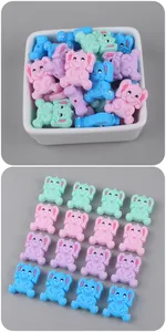 Macro detail of cartoon elephant silicone beads for DIY pacifier chains in pastel colors