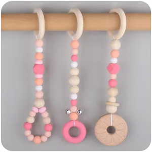 Three-piece baby gym hanging toy set with beech wood rings and silicone teething beads