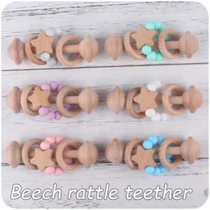 Set of 6 beech wood and silicone bead baby rattles in pastel colors on white wood
