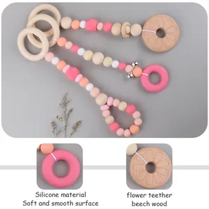 3-piece wooden beech and silicone baby teether rattle set with pink floral pendants