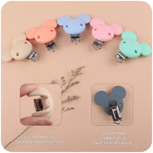 Five pastel cartoon silicone baby pacifier clips shown with soft texture detail