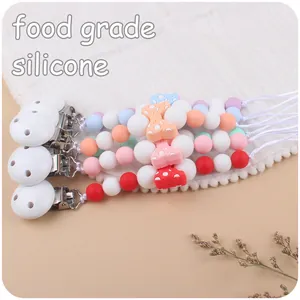 Three sets of silicone baby pacifier clips with colorful beads and bow decorations