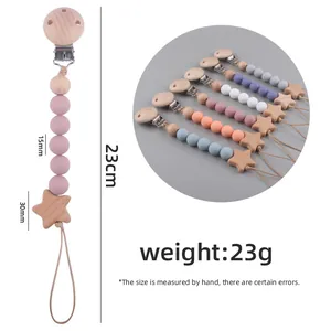 Beech wood and silicone bead baby pacifier clip with star pendant in soft pastel colors