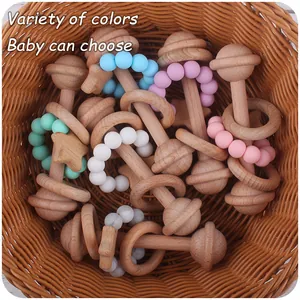 Macro detail of various colorful silicone beads and beech wood rings for baby teething toys