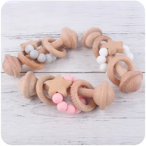 Detail of wooden baby rattles with food-grade silicone beads and star-shaped charms