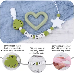 Detailed view of green leaf and heart silicone teethers with a beaded pacifier chain