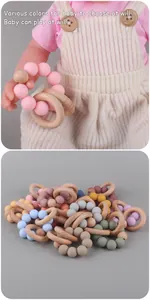 Detail of baby teething ring set with silicone beads and natural beech wood rings