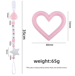Detailed view of baby teething set with silicone beads and pink heart-shaped teether