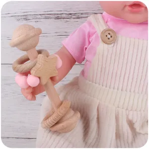 Wooden baby rattle with silicone beads and star detail for grasping and teething exercise