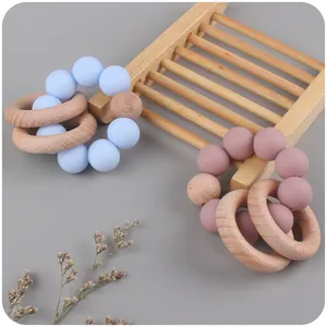 DIY silicone and beech wood baby teething rings in sky blue and dusty pink colors