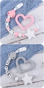Detailed view of silicone teething clips with BABY beads and star-shaped teethers