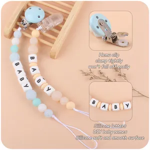 DIY silicone pacifier clips with wood accents and letter beads for infant teething support