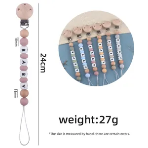Handmade beech wood and silicone baby pacifier clip with 24cm length and 'BABY' letter beads