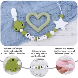 Silicone baby pacifier clip set with forest green leaf clip and heart-shaped teether