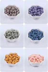 Macro detail of silicone abacus beads in six soft colors for DIY baby pacifier clips