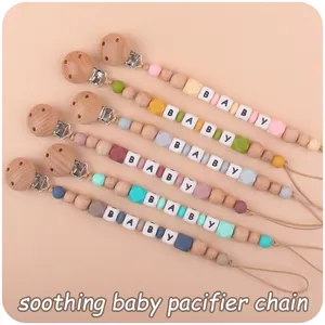 Close-up of multi-colored beech wood and silicone bead pacifier chains