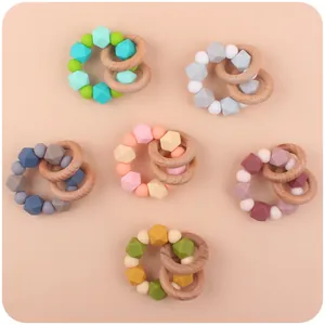 Set of 6 silicone and beech wood baby teething rings and pacifier clips in various colors