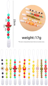 Detailed view of baby silicone pacifier clip with colorful beads and fruit charms