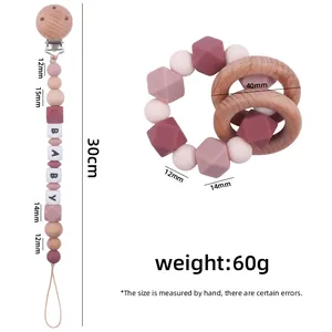Beech wood pacifier clip and silicone teething ring set in pink and purple tones