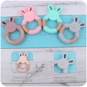 Detail of baby bunny teether made of safe soft silicone and natural beech wood ring
