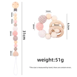 Handmade wooden pacifier clip and crochet bead teething ring set in soft pastel colors