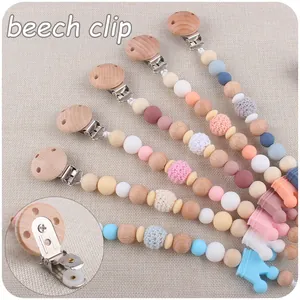 Beech wood and silicone baby pacifier clips set with crochet beads and crown detail