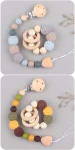 Detail of DIY baby pacifier clip and wooden teether with crochet and silicone beads