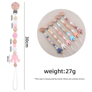 Handmade beech wood and silicone crown pacifier clip for baby soothing and teething