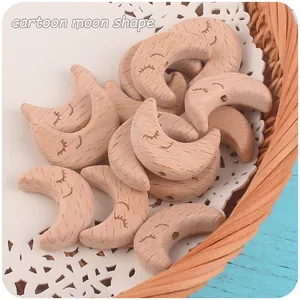 Detailed macro view of cartoon moon beech wood beads with laser engraved closed eyes