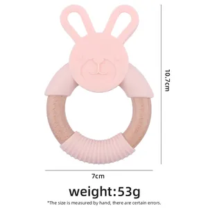 Pink silicone rabbit and beech wood teething ring for infants, 10.7cm height, weight 53g