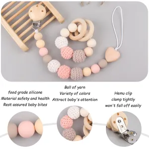 Pink and grey crochet bead pacifier clip with beech wood rings for baby teething