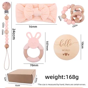 Pink silicone rabbit teether and bow headband baby gift set with pacifier clip in box